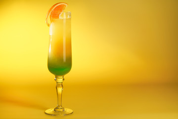 Moscow Lights cocktail in a champagne glass garnished with an orange slice