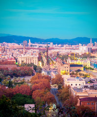 Barcelona at nightfall; part of the coastal