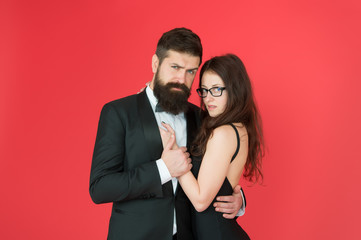 Feel rhythm of heart. Lets dance tonight. Elegant couple in love tender hug dancing red background. Happy together. Man in tuxedo and woman black dress dancing at party. Passionate couple dancing