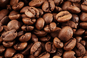 Isolated coffee bean. closeup photo. Top view. Roasted coffee beans background