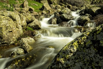 Waterfalls on a mountain stream. A delightful spring landscape. Mount Aragats. Armenia
