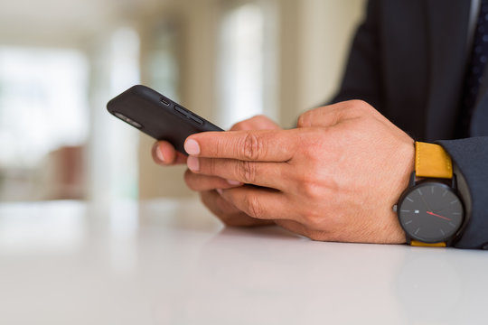 Close up of business man hands using smarpthone