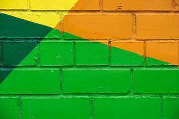 Abstract bright street colorful drawing detail of brick wall, like as graffiti closeup. Can be...