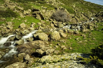 Waterfalls on a mountain stream. A delightful spring landscape. Mount Aragats. Armenia