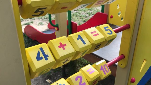 Wooden counting blocks on the children's Playground. Learning to count.