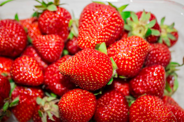 Fresh strawberries. Strawberry background. pattern texture. Macro. large, big strawberries. Harvesting organic local strawberries.