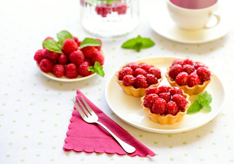 Homemade mini tarts with raspberries fruits