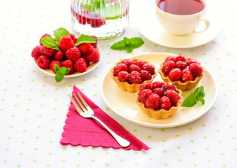Homemade mini tarts with raspberries fruits