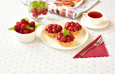 Homemade mini tarts with raspberries fruits