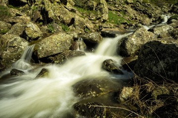 Fototapeta premium Waterfalls on a mountain stream. A delightful spring landscape. Mount Aragats. Armenia