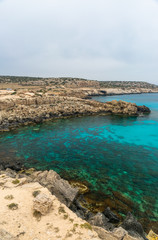 CYPRUS, CAPE CAVO GRECO - MAY 11/2018: Tourists arrived by car to the blue lagoon for swimming.