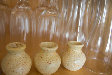 Three little pots with glasses