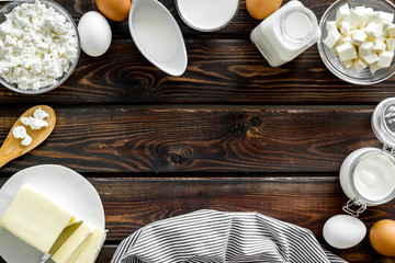 Breakfast on farm with dairy products frame on wooden background top view space for text