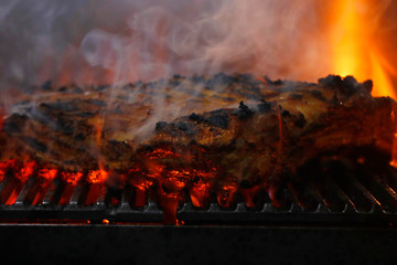 spice marinated beef short rib on barbecue grill