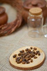 ambrosia on a wooden board on a wicker table and glass jar