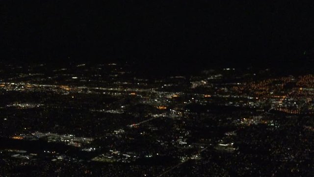 View of Salt Lake City from airplane at night during landing approach