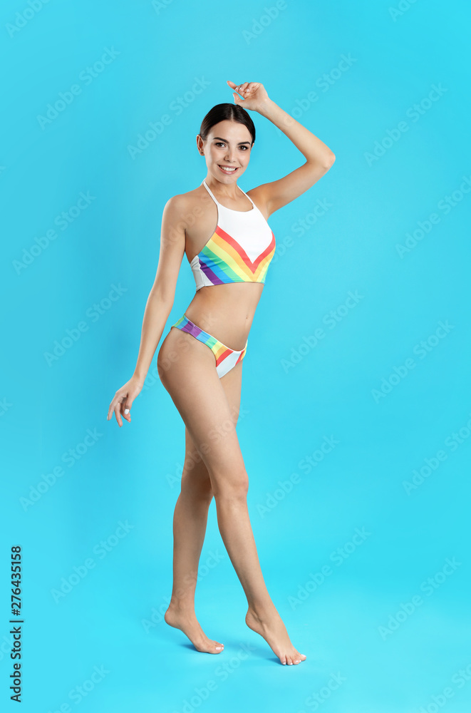 Sticker full length portrait of attractive young woman with slim body in swimwear on color background