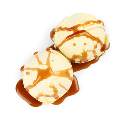 Delicious ice cream with caramel sauce on white background, top view
