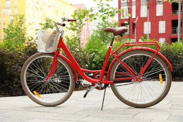 Fototapeta na wymiar Modern color bicycle with basket in park