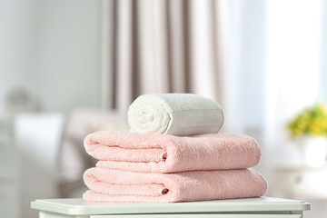 Clean soft terry towels on table indoors