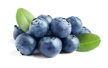 Fresh raw tasty blueberries with leaves isolated on white