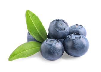 Fresh raw tasty blueberries with leaves isolated on white