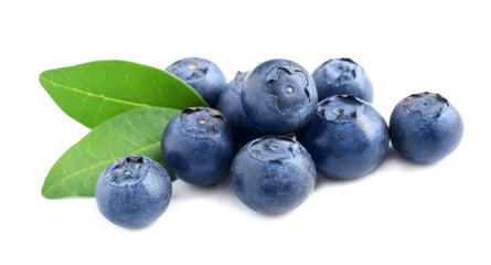 Fresh raw tasty blueberries with leaves isolated on white