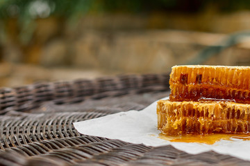 composition on a wicker table with honey comb