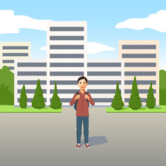 Young Latino boy with school bag or backpack standing outdoors in the road