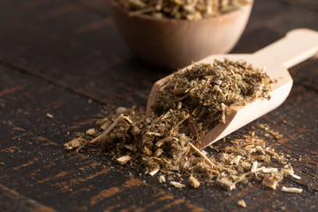 Pile of Dried Horehound on a Rustic Wooden Tabel