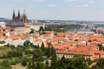 Fototapeta premium Summer Prague City with gothic Castle and the green Nature from the Hill Petrin, Czech Republic