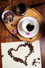 cup of drunk coffee at wooden tray
