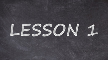 Obraz premium Lesson 1 written on blackboard