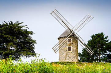 Naklejka na ściany i meble Old wind mill in Bretagne, France, Europe