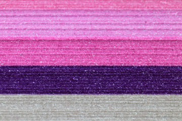 Fototapeta na wymiar Extreme close up view of stacked colored paper