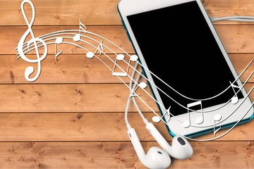 Smartphone with blank screen and earphones on  background