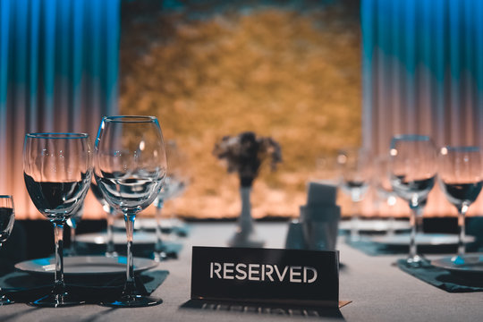 table setting with shiny wineglasses in restaurant