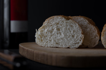 sliced fresh bread on black background