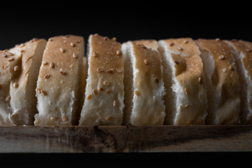 sliced fresh bread on back background
