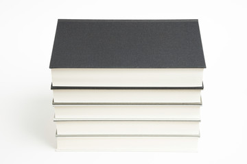 A Set Of Neatly Stacked Monochromatic Cloth Bound Books