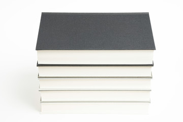 A Set Of Neatly Stacked Monochromatic Cloth Bound Books