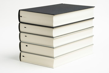 A Set Of Neatly Stacked Monochromatic Cloth Bound Books