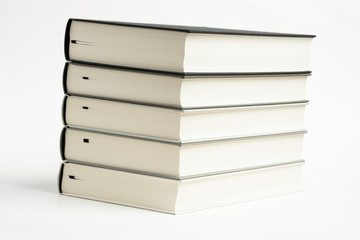 A Set Of Neatly Stacked Monochromatic Cloth Bound Books