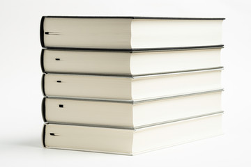 A Set Of Neatly Stacked Monochromatic Cloth Bound Books