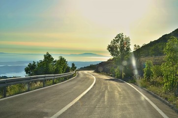 Photo of the road heading to the coastline. Beautiful view of the mountains in Croatia right next to the Adriatic sea.