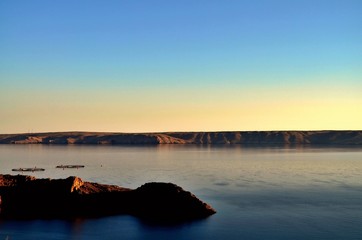 Sunset taken with my camera on the way to Zadar in Croatia. The sea was calm and you could see all the rocks and island. 