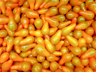 Yellow  cherry tomatoes pear-shaped in large quantities.