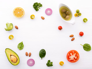 Food background and salad concept with raw ingredients  flat lay on white wooden background.