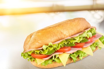 Ham and cheese salad submarine sandwich from freshly cut baguette