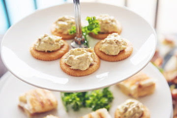 snack refreshment crackers on white dishes